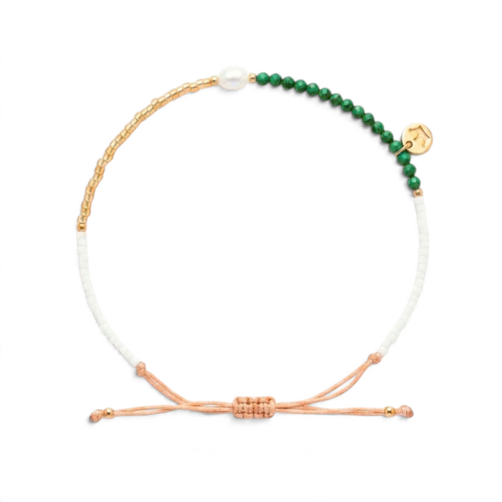 Niche Jewellery Jersey Pearl Noma bracelet featuring green malachite, white freshwater pearl, and gold-tone beads.