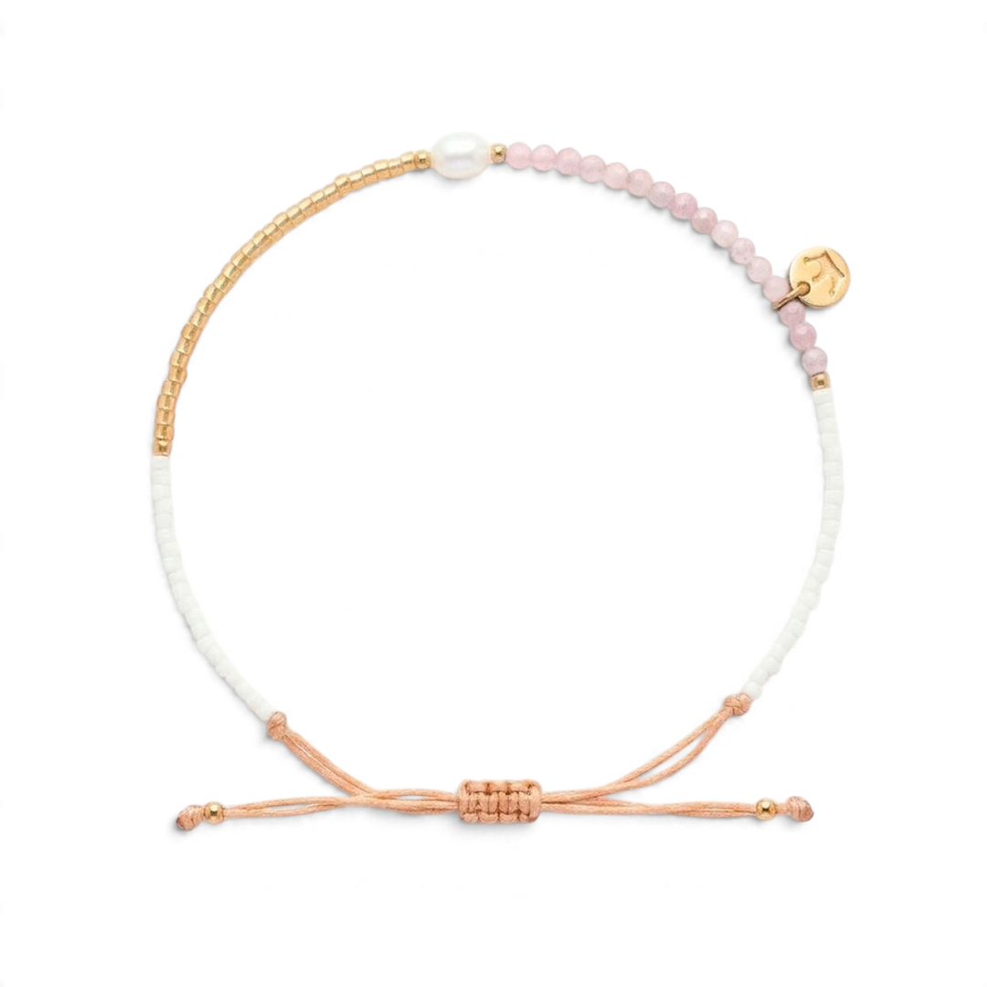 Niche Jewellery Jersey Pearl Noma bracelet featuring pink sunstone beads, a white freshwater pearl, and gold accents.