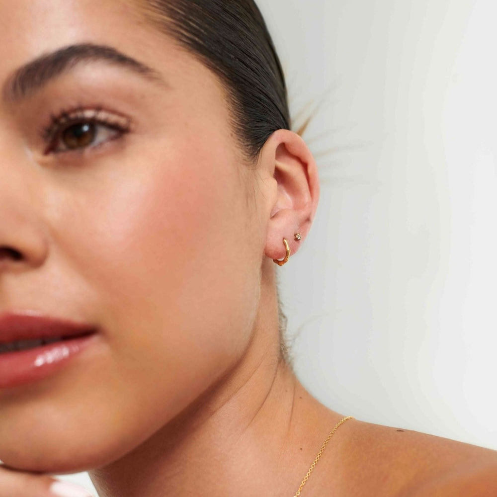 D.Louise Bamboo Gold Huggie Hoop Earrings close up