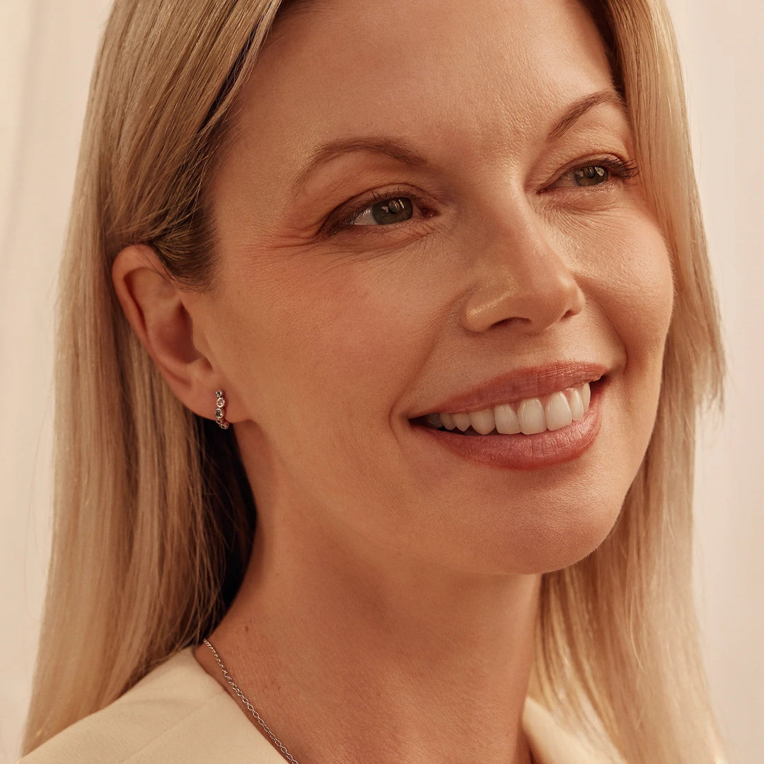 Niche Jewellery: Clogau Sterling silver curved stud earrings with white topaz and rose gold accents. Bubble design.
