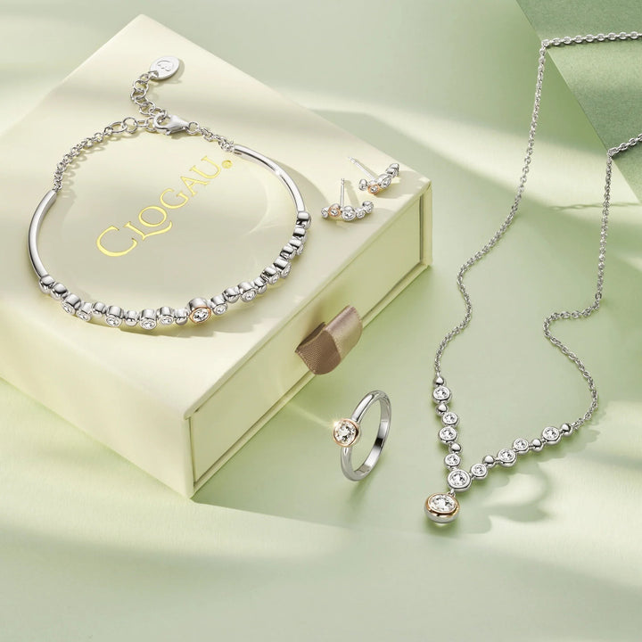 Niche Jewellery: Clogau Sterling silver curved stud earrings with white topaz and rose gold accents. Bubble design.