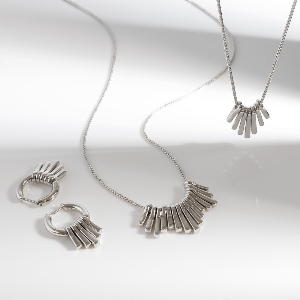 Niche Jewellery Kit Heath rhodium-plated sterling silver dangle hoop drop earrings with five graduating pendants.