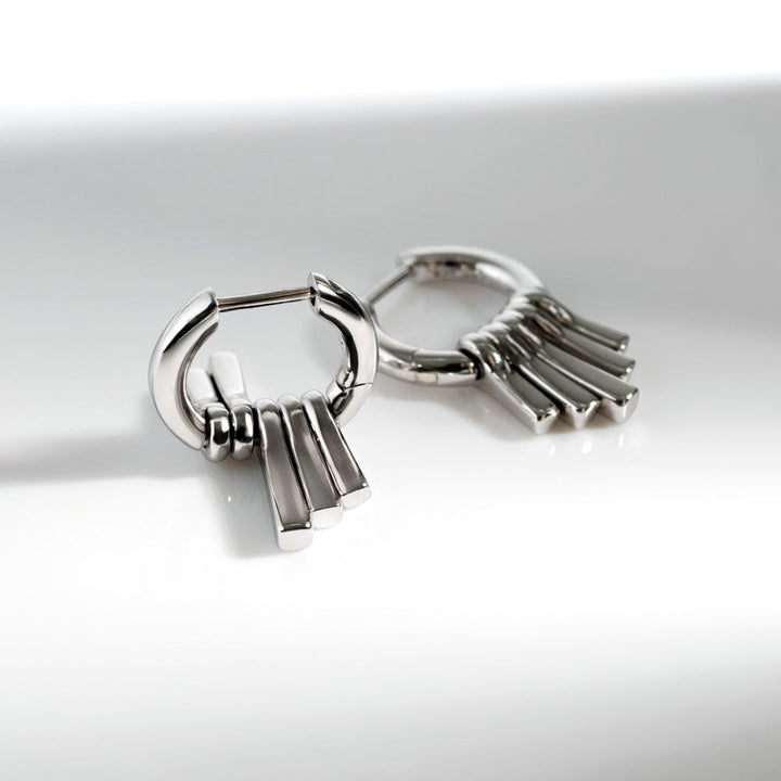 Niche Jewellery Kit Heath rhodium-plated sterling silver dangle hoop drop earrings with five graduating pendants.