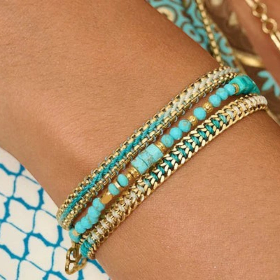 Niche Jewellery Boho Betty Bloom gold and turquoise braided bracelet with turquoise beads and snake chain.