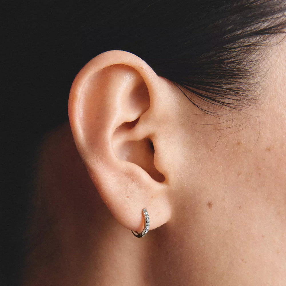 Niche Jewellery Thomas Sabo Huggie Hoop Earrings Silver with White Zirconia worn on model