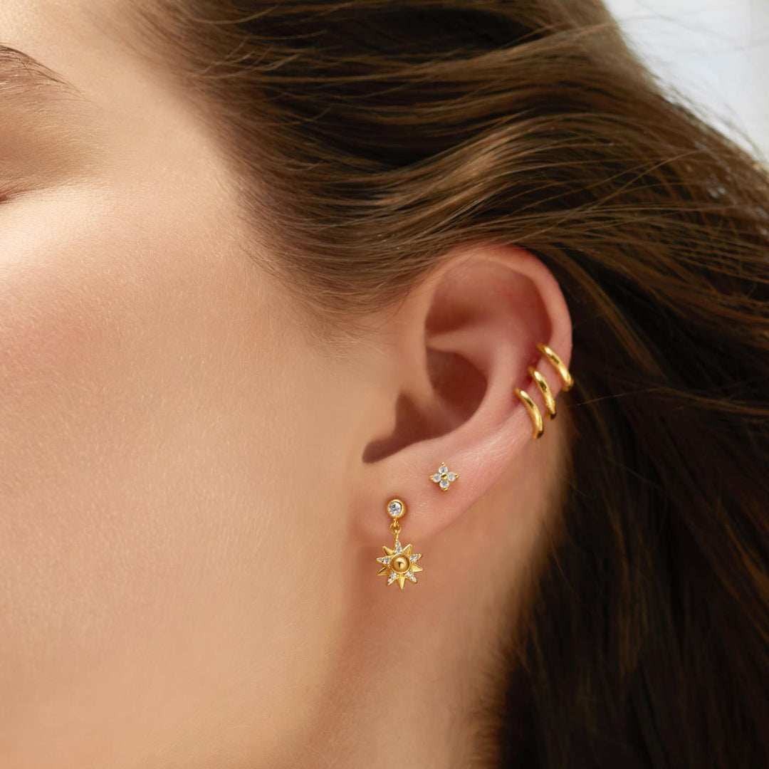Niche Jewellery Ania Haie Sunburst Dangle Stud Gold Earrings worn on model