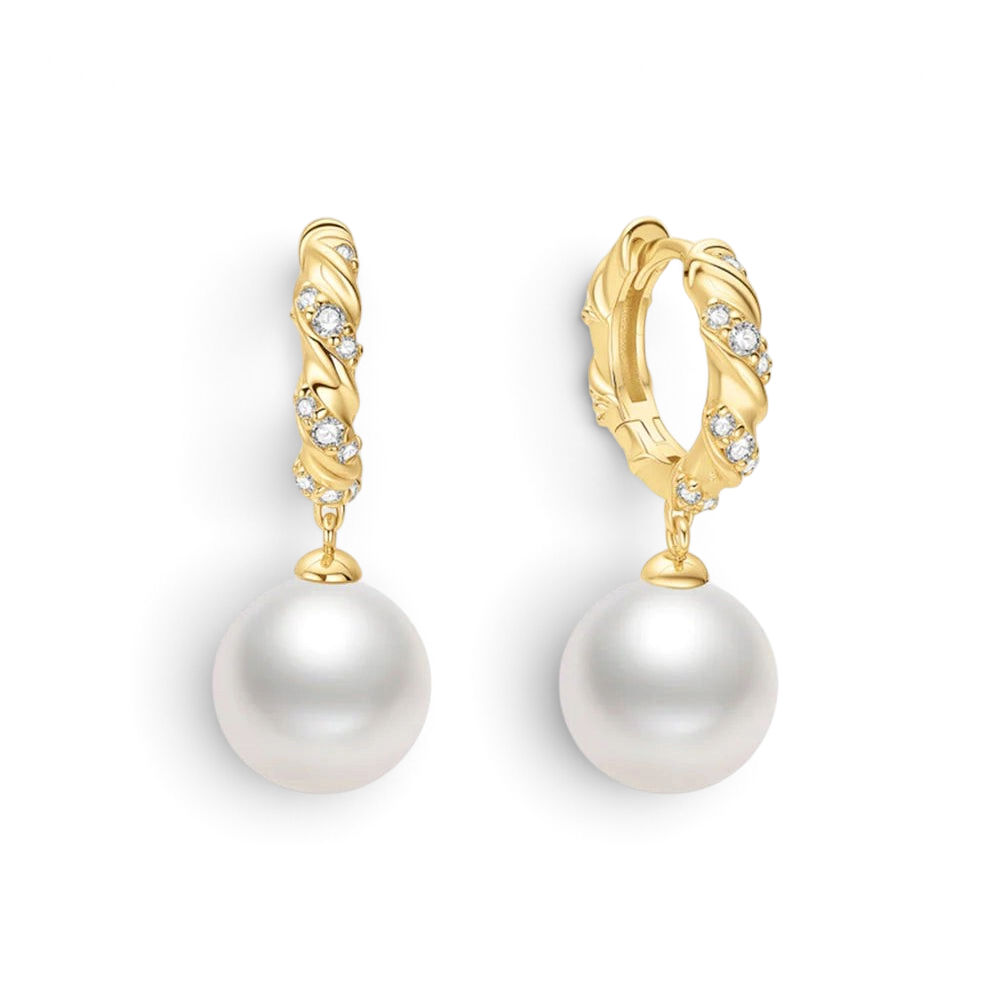 Niche Jewellery Ania Haie gold twisted huggie hoop earrings with pavé cubic zirconia and dangling shell pearls.