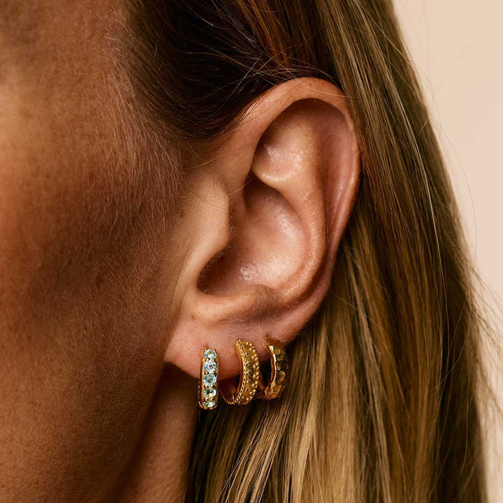 Charlotte's Web Kali Huggie Hoops - Gold Blue Topaz