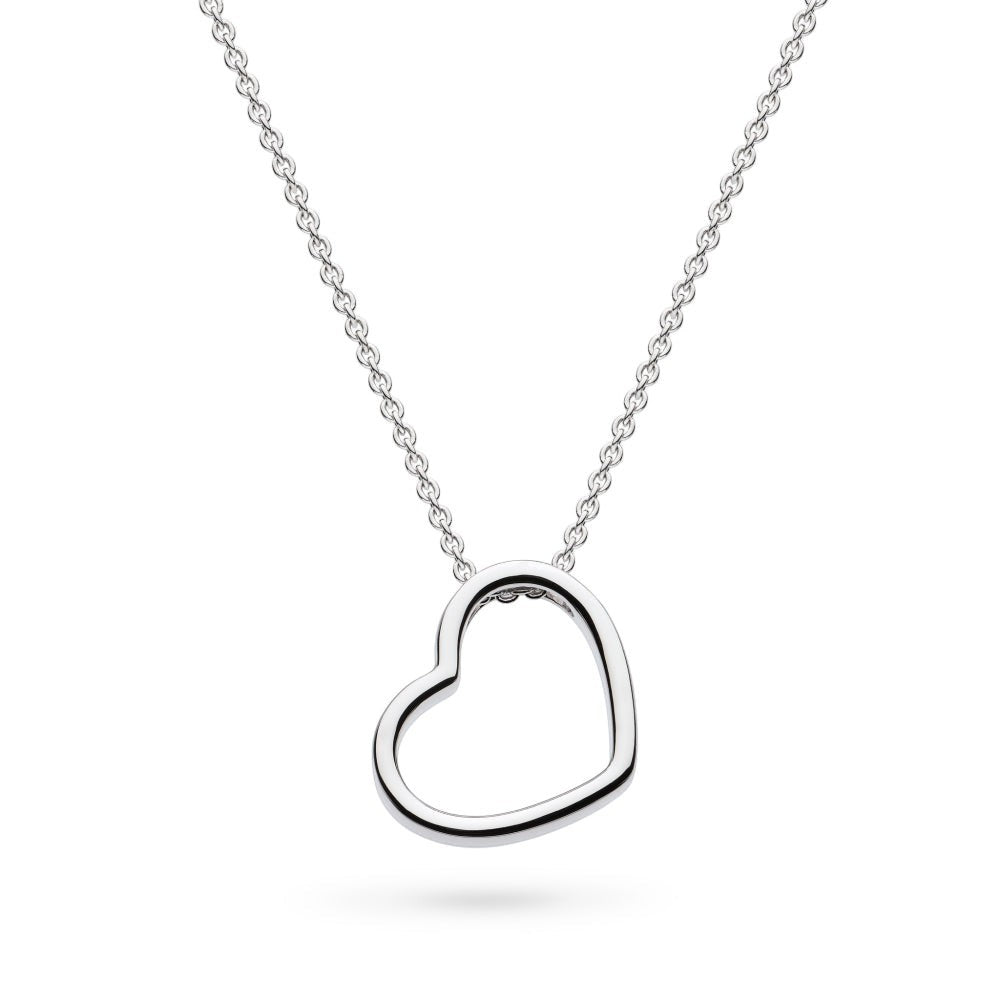 Niche Jewellery: Kit Heath sterling silver necklace with a delicate heart outline pendant that sits at a subtle angle.