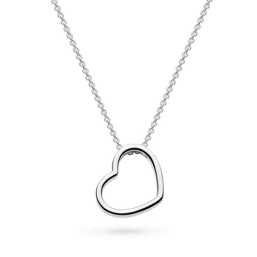 Niche Jewellery: Kit Heath sterling silver necklace with a delicate heart outline pendant that sits at a subtle angle.