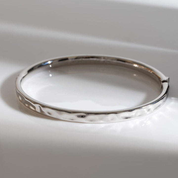 Niche Jewellery Sterling Silver Mirage Reflect Hinged Bangle with hammered texture.