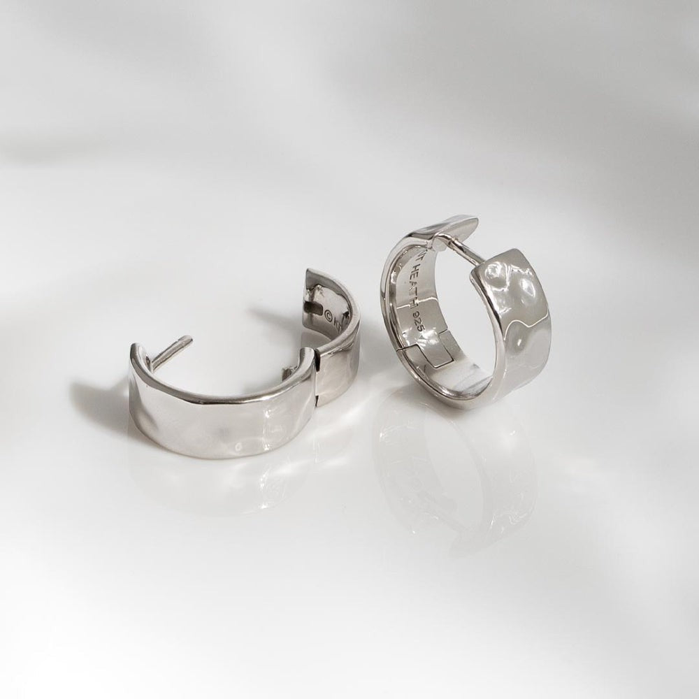 Kit Heath Mirage Reflect Wide Hinged Hoop Earrings in Sterling Silver with a dappled texture. Hinged design.