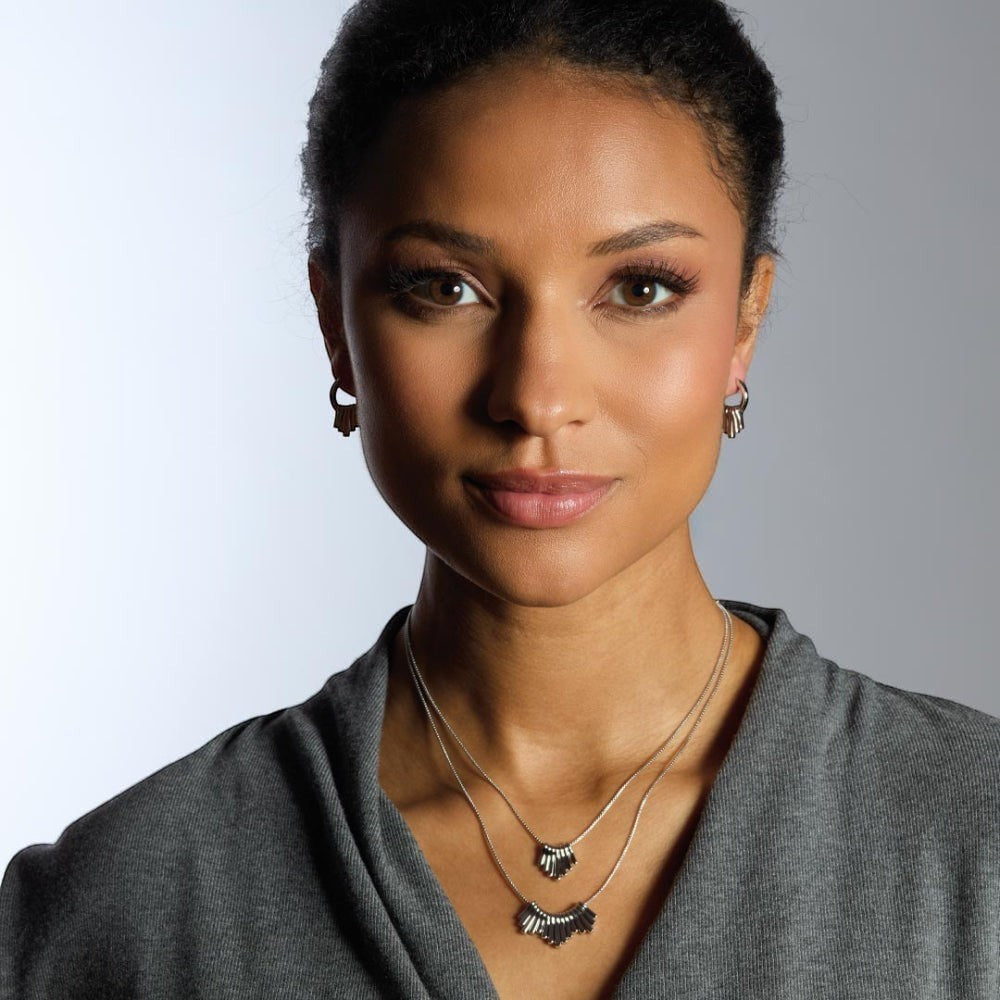 Niche Jewellery Kit Heath rhodium-plated sterling silver dangle hoop drop earrings with five graduating pendants.