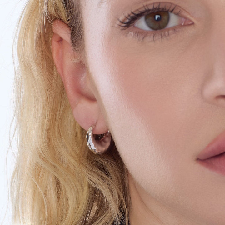 Niche Jewellery Kit Heath Mirage Reflect sterling silver hinged hoop earrings with dappled texture.