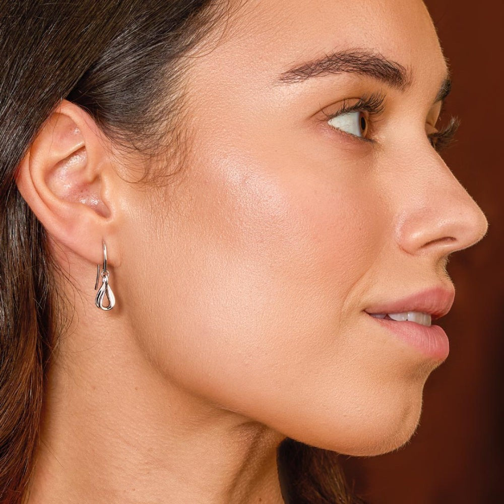 Niche Jewellery Kit Heath Serenity Loop dainty drop earrings in rhodium-plated sterling silver with fluid curves.