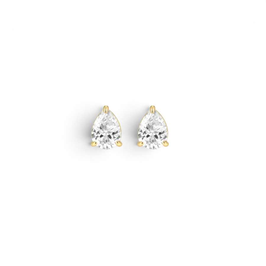 Niche Jewellery D.Louise gold pear-shaped solitaire stud earrings with clear stones on a neutral background