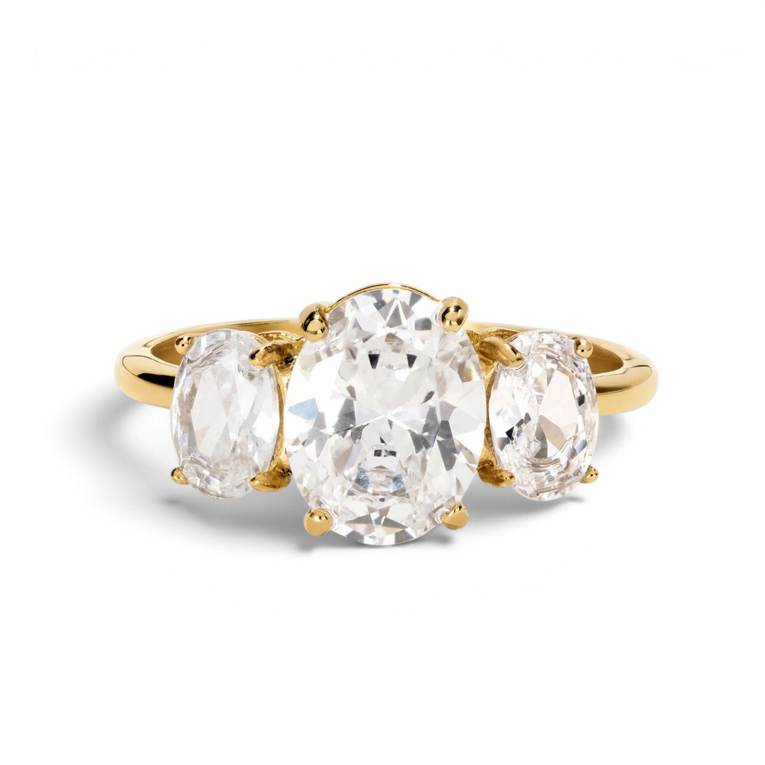 Niche Jewellery D.Louise oval trilogy ring with three diamond-inspired stones set in a polished gold band.