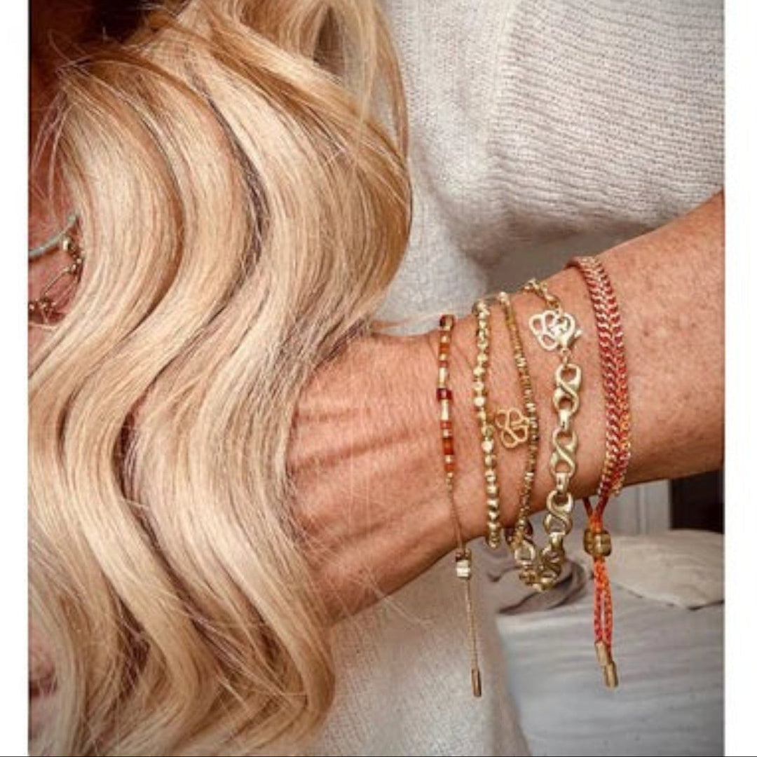 Niche Jewellery Boho Betty Zora gold bead layering bracelet with faceted beads and signature charm. Waterproof 14k PVD gold finish.