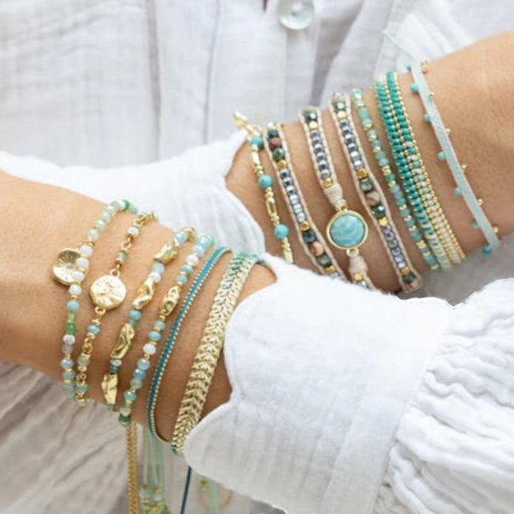 Boho Betty Serena adjustable bracelet with turquoise howlite, jade gemstones and gold-plated accents.