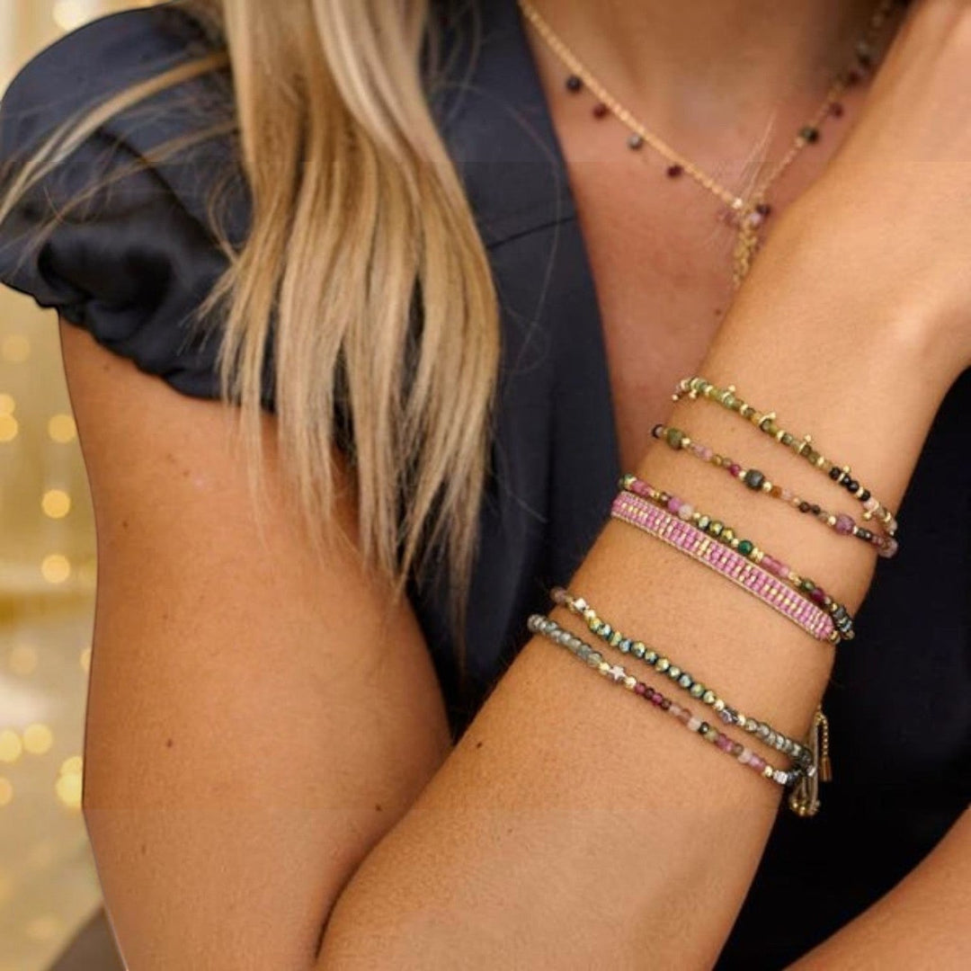 Boho Betty Ardisia Tourmaline and Gold Bead Bracelet featuring faceted tourmaline, malachite beads, and 12k gold-plated accents.