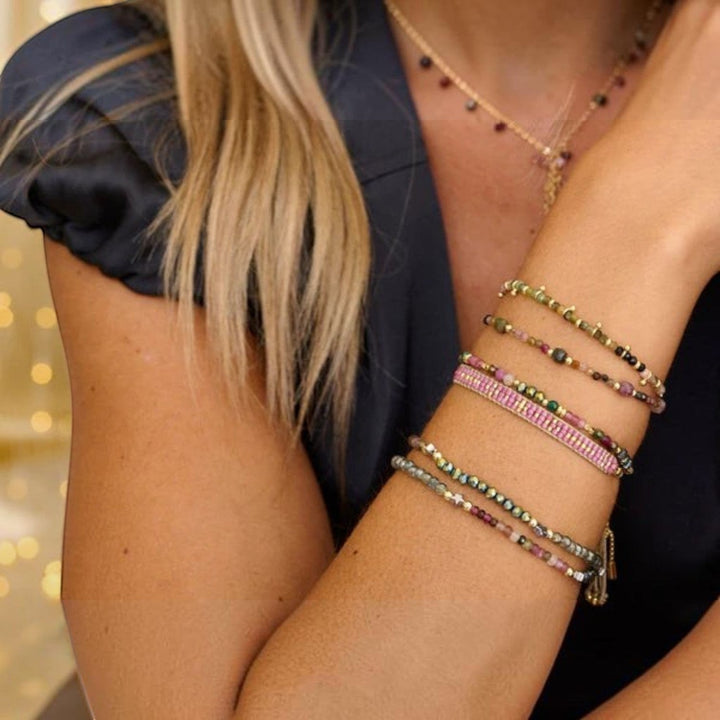 Boho Betty Ardisia Tourmaline and Gold Bead Bracelet featuring faceted tourmaline, malachite beads, and 12k gold-plated accents.