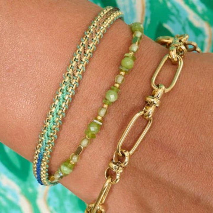 Niche Jewellery Boho Betty Bloom gold braided bracelet with taupe and green ombre thread and gold snake chain.