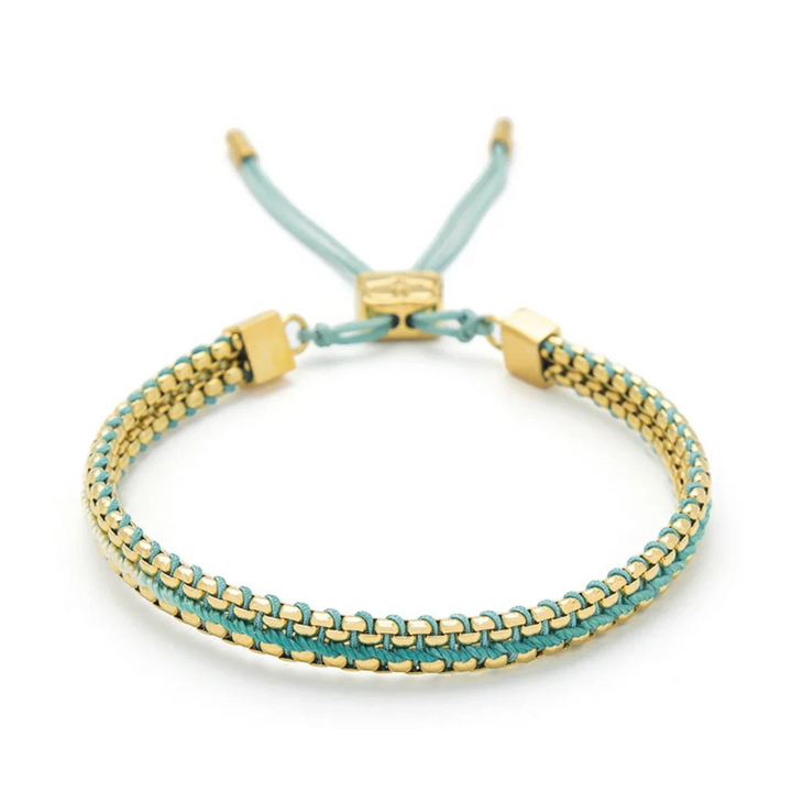 Niche Jewellery Boho Betty Bloom gold and turquoise braided slider bracelet with adjustable cord.