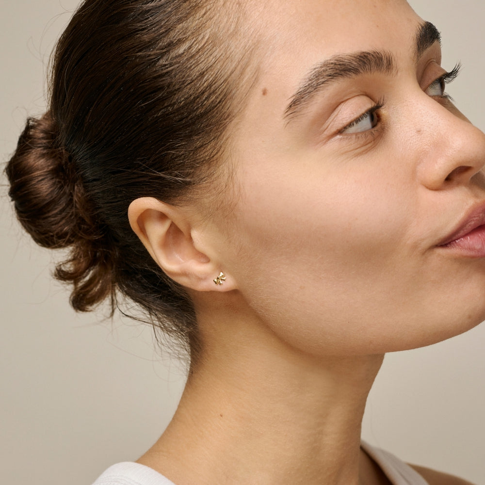 Enamel Copenhagen Baby Bow Gold Stud Earrings. Item code E440G.