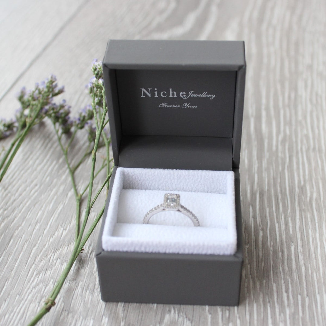 Emerald Cut Engagement Halo Ring with Diamond Set Shoulders