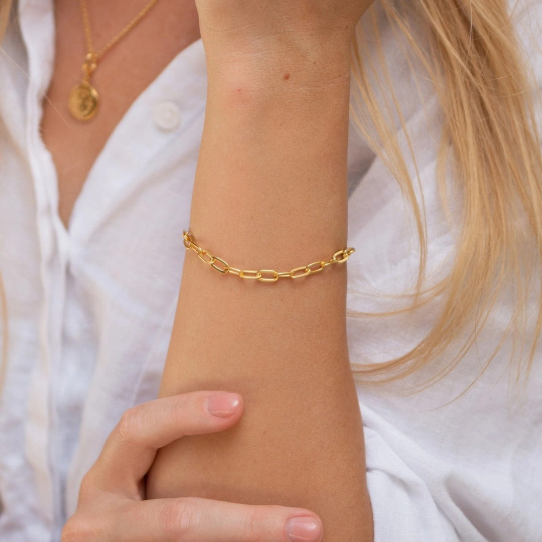 Lily Charmed Chunky Oval Link Charm Gold Bracelet. Item code CBRGCNKOV