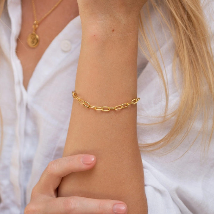 Lily Charmed Chunky Oval Link Charm Gold Bracelet. Item code CBRGCNKOV