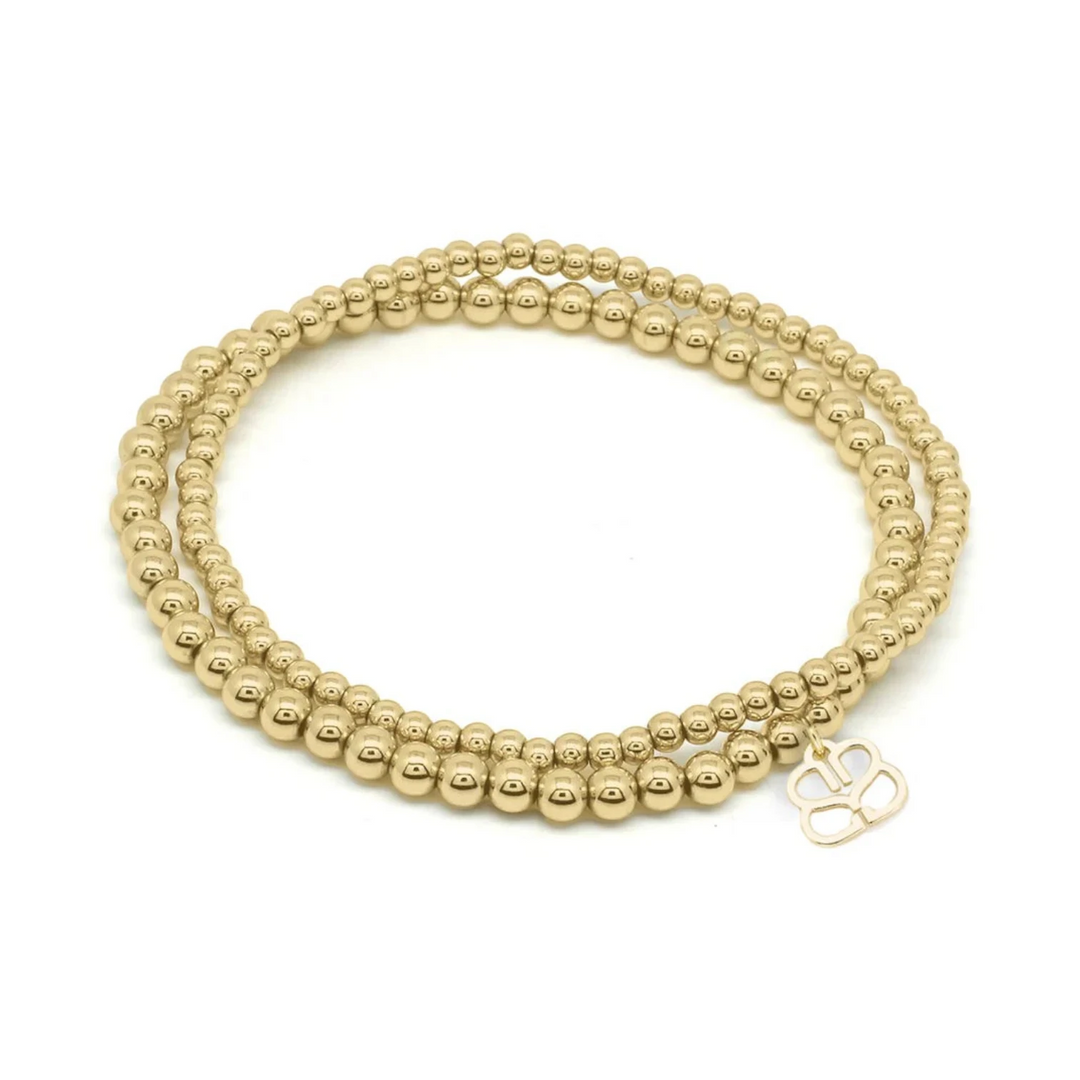 Niche Jewellery Boho Betty Kamini gold stretch bead bracelet set with 3mm and 4mm beads and a charm.