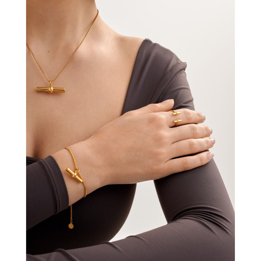 Katie Loxton Themis Waterproof Gold T-Bar Bracelet. Item code KLJ6457.