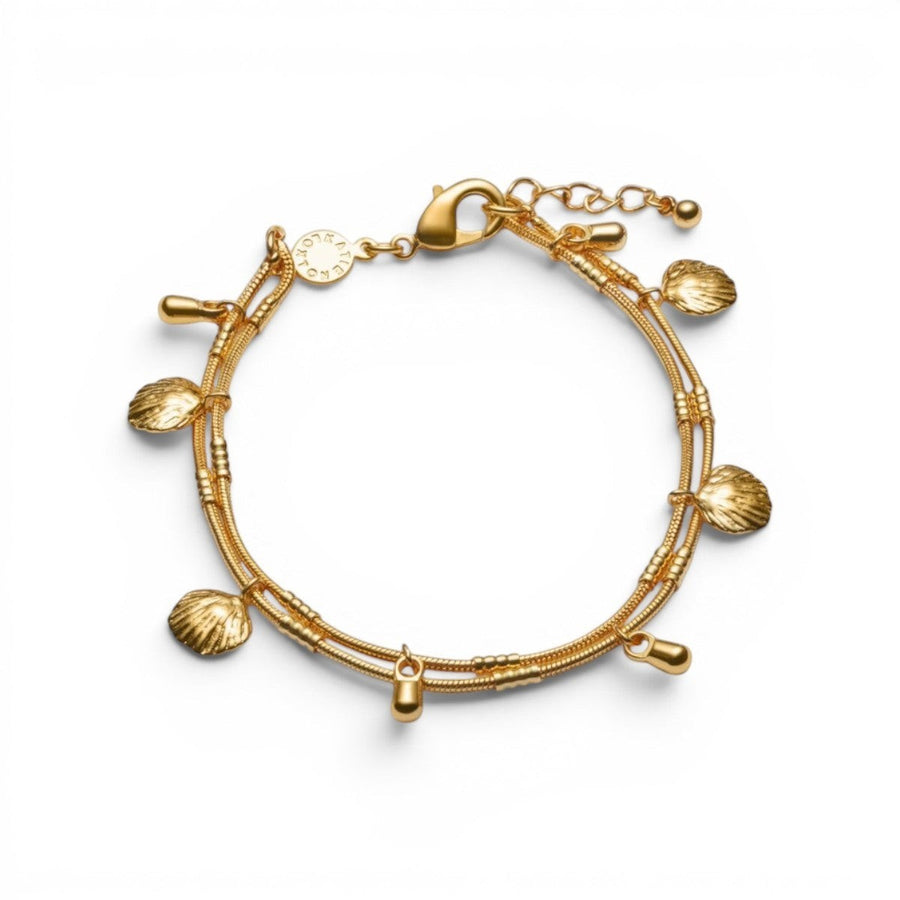 Niche Jewellery Cochellia gold bracelet with shell charms and bead details, waterproof 18K PVD coating.