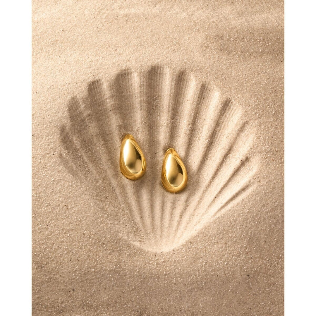 Niche Jewellery: Katie Loxton Aura waterproof gold teardrop hoop earrings with 18K gold PVD coating.