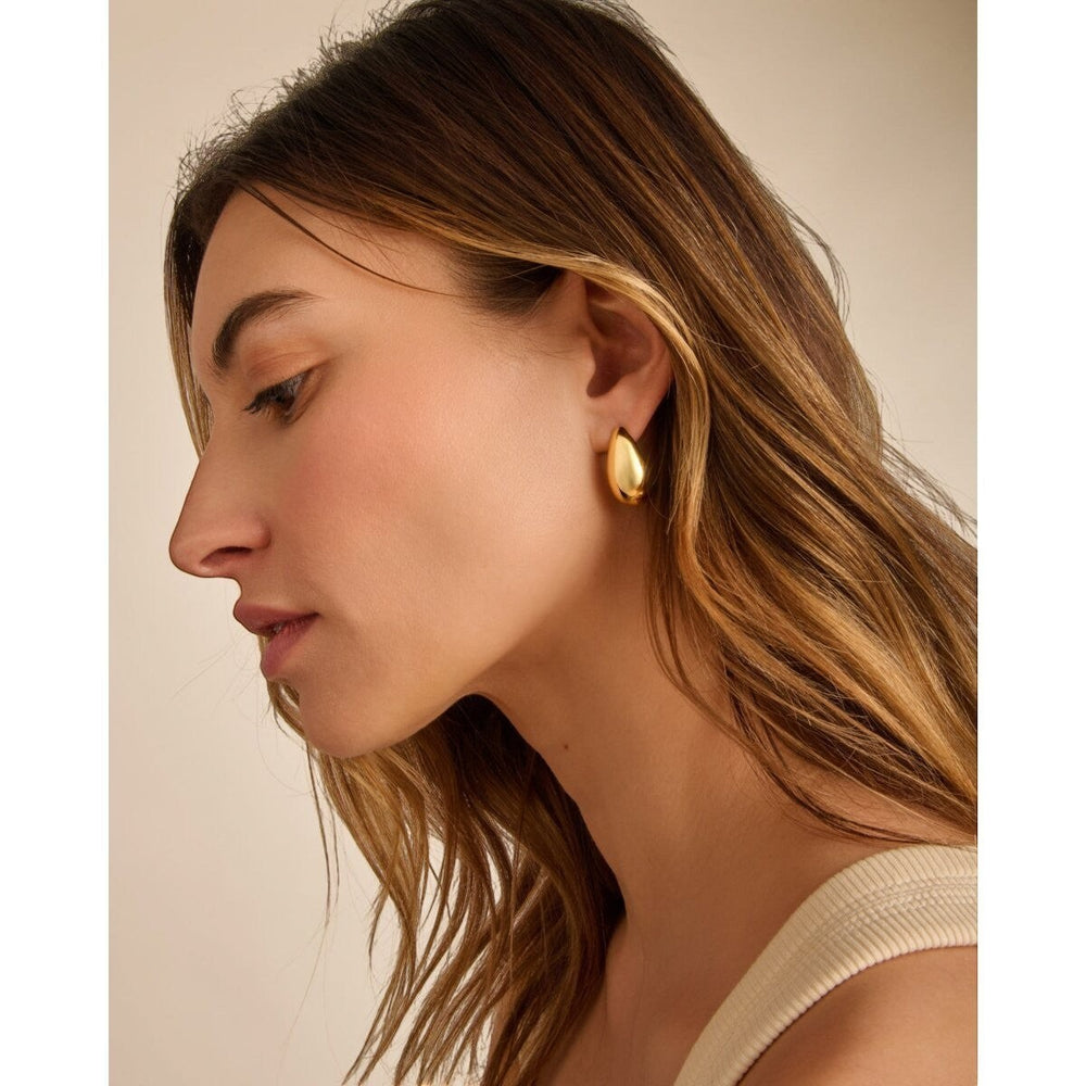 Niche Jewellery: Katie Loxton Aura waterproof gold teardrop hoop earrings with 18K gold PVD coating.