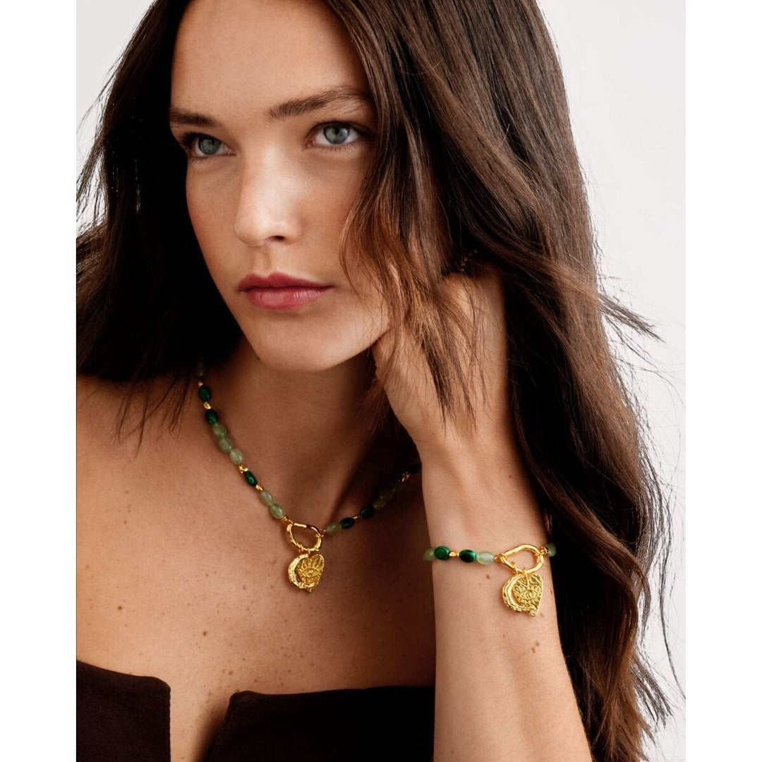 Niche Jewellery Katie Loxton Palma Solesi gold bracelet with green beads, crescent moon and evil eye charms. Waterproof.