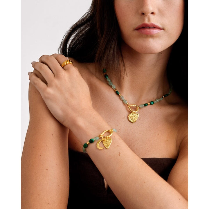 Niche Jewellery Katie Loxton Palma Solesi gold bracelet with green beads, crescent moon and evil eye charms. Waterproof.