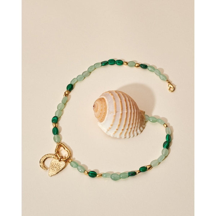 Niche Jewellery Katie Loxton Palma Solesi gold bracelet with green beads, crescent moon and evil eye charms. Waterproof.