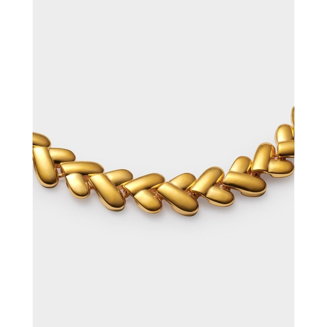 Niche Jewellery: Katie Loxton gold bracelet with interlocking heart links, adjustable chain, and lobster clasp. Waterproof 18K Gold PVD.