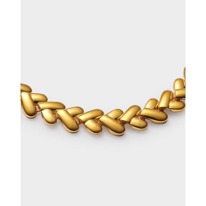 Niche Jewellery: Katie Loxton gold bracelet with interlocking heart links, adjustable chain, and lobster clasp. Waterproof 18K Gold PVD.