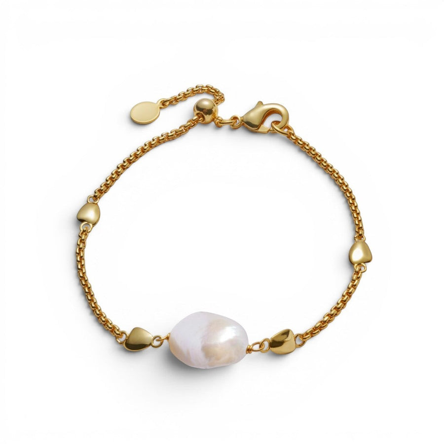 Niche Jewellery: Katie Loxton Sol Pearl bracelet with freshwater pearl and gold hearts on a gold chain.