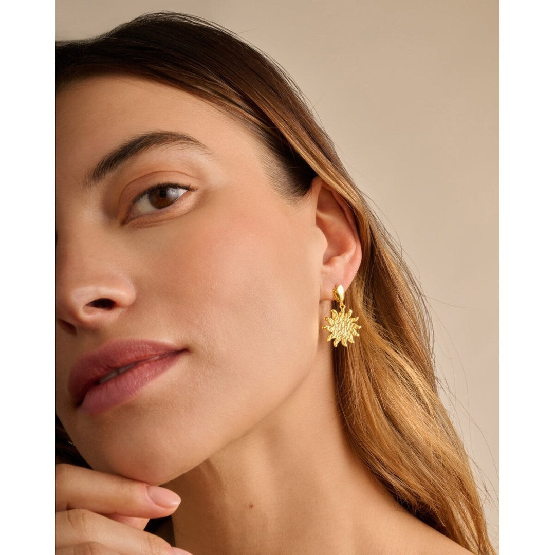 Niche Jewellery: Katie Loxton Solesi Sun Waterproof Gold Earrings featuring a textured sun charm with 18K Gold PVD coating.