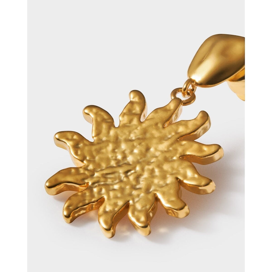 Niche Jewellery: Katie Loxton Solesi Sun Waterproof Gold Earrings featuring a textured sun charm with 18K Gold PVD coating.