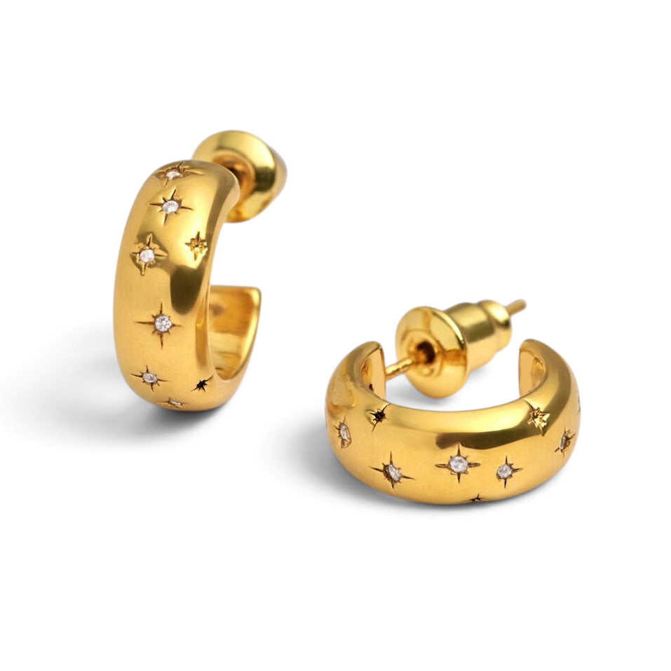 Niche Jewellery Katie Loxton gold hoop earrings featuring scattered star engravings and small sparkling crystals.