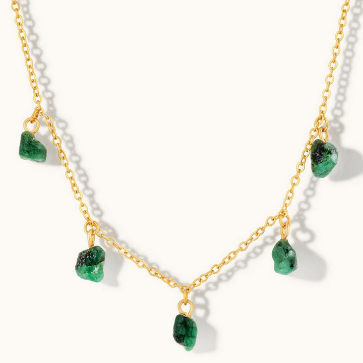 Niche Jewellery Mohica choker featuring five raw-cut emerald charms on an 18k gold plated sterling silver chain.