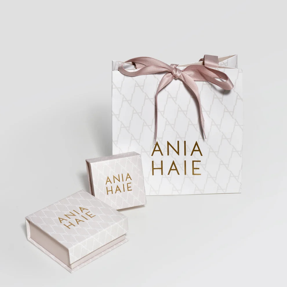 Niche Jewellery branded gift bag and two white jewellery boxes with Ania Haie logo and pink ribbon