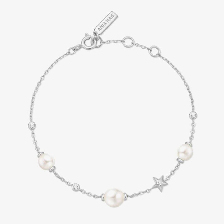 Niche Jewellery Ania Haie rhodium-plated sterling silver bracelet featuring shell pearls and a star station charm.