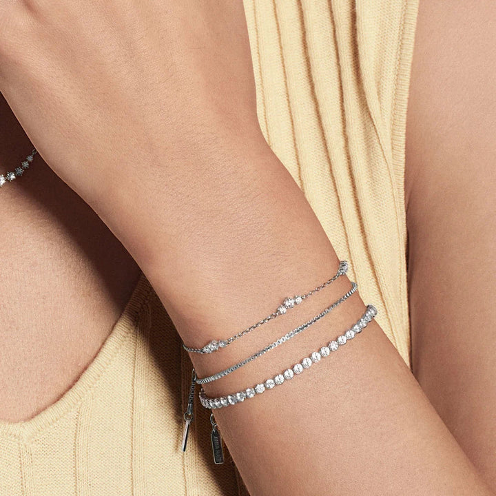 Niche Jewellery Ania Haie sterling silver cluster station bracelet with cubic zirconia on a woman's wrist
