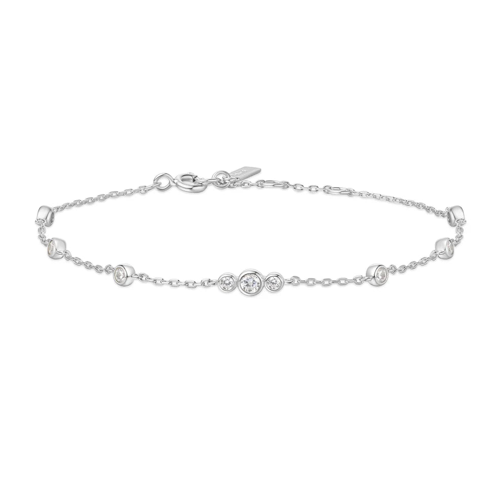 Niche Jewellery Ania Haie rhodium-plated sterling silver bracelet with bezel-set cubic zirconia stations.